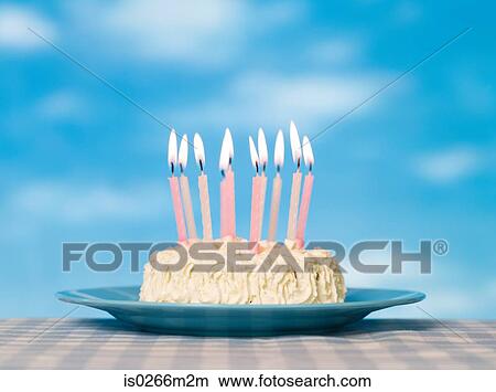 Candles on a birthday cake View Large Photo Image Picture - Candles on a birthday cake. Fotosearch