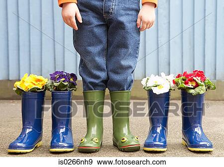 Child and rubber boots View Large Photo Image Stock Photo - Child and rubber boots. Fotosearch