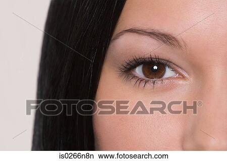 Close up on a young womans eye View Large Photo Image Picture - Close up on a young womans eye . Fotosearch