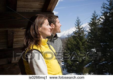 Couple at chalet View Large Photo Image Stock Image - Couple at chalet. Fotosearch