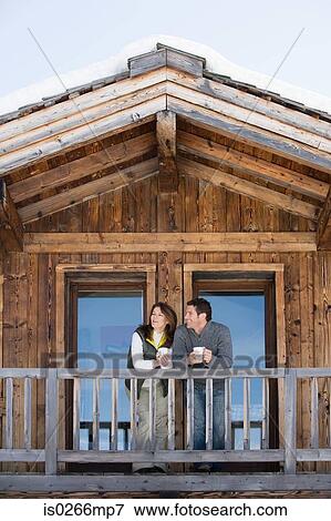 Couple at chalet View Large Photo Image Stock Photo - Couple at chalet. Fotosearch