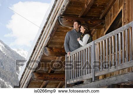 Couple at chalet View Large Photo Image Stock Photo - Couple at chalet. Fotosearch