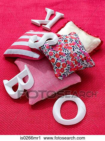 Cushions and letters on a carpet View Large Photo Image Stock Image - Cushions and letters on a carpet. Fotosearch