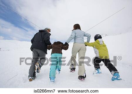 Stock Photo - Family in the snow. Fotosearch
