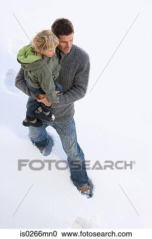 Father and son in snow View Large Photo Image Stock Image - Father and son in snow. Fotosearch