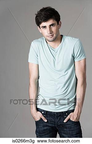 Man with his hands in his pockets View Large Photo Image Stock Image - Man with his hands in his pockets. Fotosearch