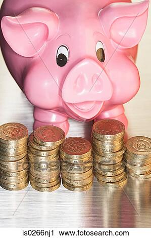 Stock Image - Piggy bank and coins. Fotosearch
