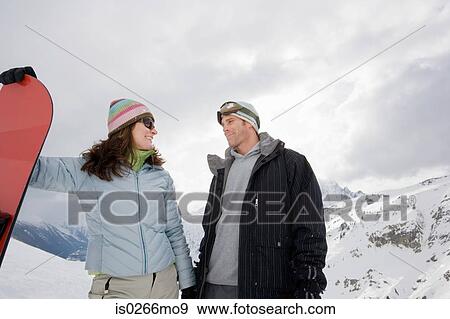 Snowboarder couple View Large Photo Image Stock Photo - Snowboarder couple. Fotosearch