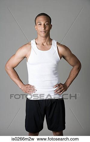 Sportsman with hands on hips View Large Photo Image Stock Photo - Sportsman with hands on hips. Fotosearch