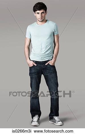 Studio shot of a man with his hands in his pockets View Large Photo Image Stock Image - Studio shot of a man with his hands in his pockets. Fotosearch