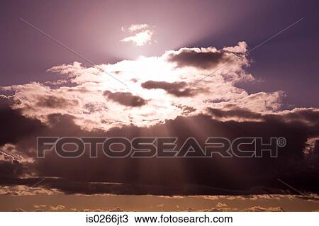 Sunlight through clouds View Large Photo Image Stock Image - Sunlight through clouds. Fotosearch