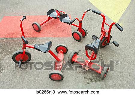Stock Photo - Tricycles in playground. Fotosearch