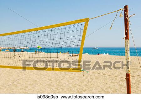 Stock Image - Volleyball net on beach. Fotosearch