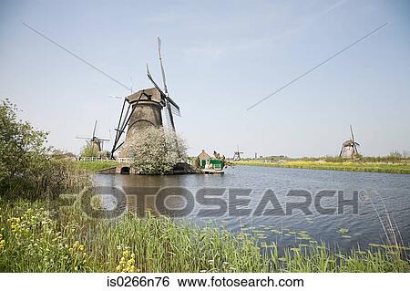 Windmills at kinderdijk View Large Photo Image Stock Photograph - Windmills at kinderdijk. Fotosearch