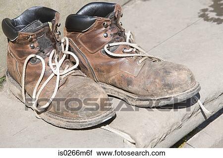 Stock Image - Worn boots. Fotosearch