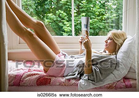 Young woman reading View Large Photo Image Stock Photograph - Young woman reading. Fotosearch