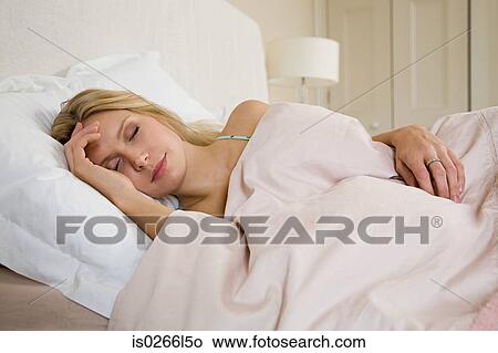 Young woman sleeping View Large Photo Image Picture - Young woman sleeping. Fotosearch