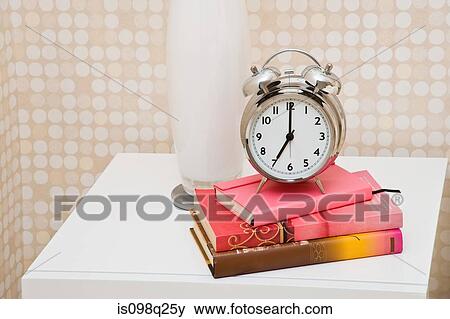 Alarm clock on bedside table View Large Photo Image Stock Photo - Alarm clock on bedside table. Fotosearch