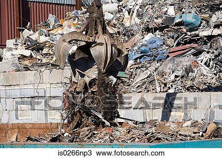 Stock Image - An excavator and rubble. Fotosearch