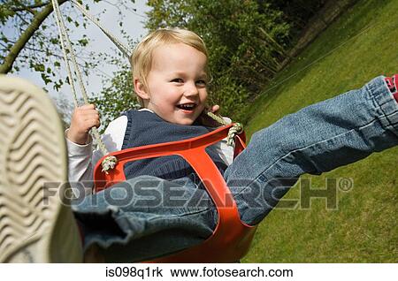 Boy on a swing View Large Photo Image Stock Image - Boy on a swing. Fotosearch