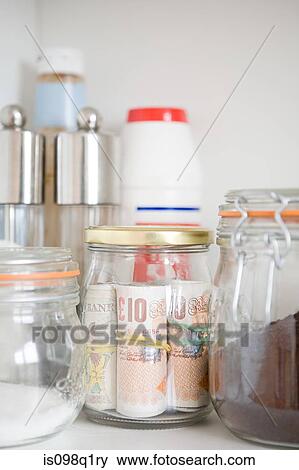 British banknotes in a jar View Large Photo Image Stock Photo - British banknotes in a jar. Fotosearch