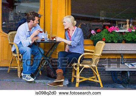Stock Image - Couple at cafe. Fotosearch