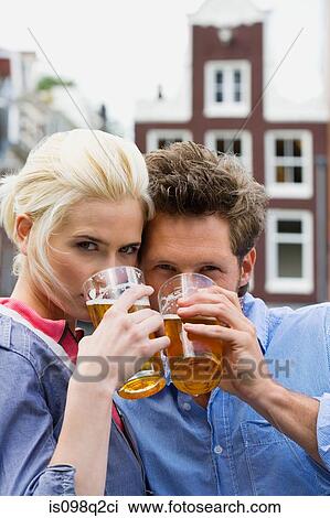 Couple drinking beer View Large Photo Image Stock Image - Couple drinking beer. Fotosearch