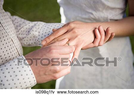 Couple getting married outdoors View Large Photo Image Stock Photo - Couple getting married outdoors. Fotosearch