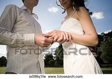 Stock Photo - Couple getting married outdoors. Fotosearch