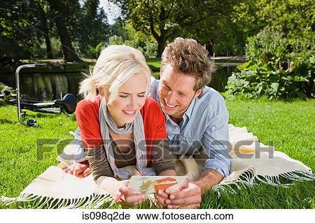 Couple in park View Large Photo Image Stock Image - Couple in park. Fotosearch