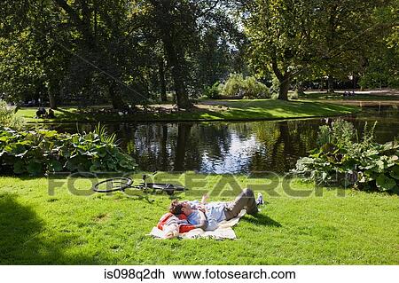 Couple in park View Large Photo Image Stock Image - Couple in park. Fotosearch
