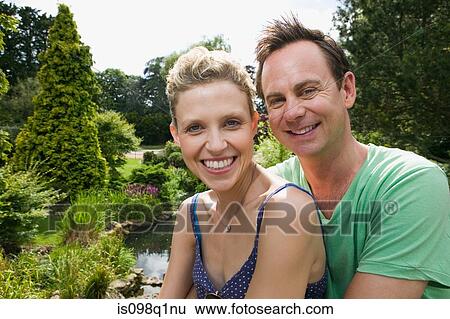 Couple in park View Large Photo Image Stock Photograph - Couple in park. Fotosearch