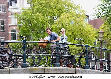Stock Photo - Couple on bicycle. Fotosearch