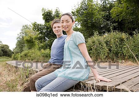 Couple outdoors View Large Photo Image Stock Image - Couple outdoors. Fotosearch