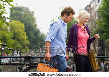 Couple walking View Large Photo Image Stock Photo - Couple walking. Fotosearch