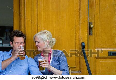 Couple with beer View Large Photo Image Stock Image - Couple with beer. Fotosearch