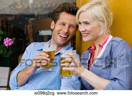 Couple with beer View Large Photo Image Stock Image - Couple with beer. Fotosearch