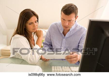 Couple with letter View Large Photo Image Stock Photo - Couple with letter. Fotosearch