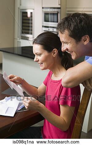 Stock Image - Couple with mail. Fotosearch
