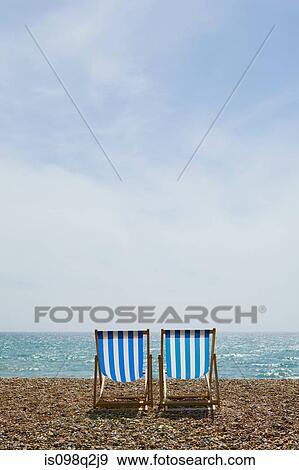 Deckchairs on brighton beach View Large Photo Image Stock Photo - Deckchairs on brighton beach. Fotosearch