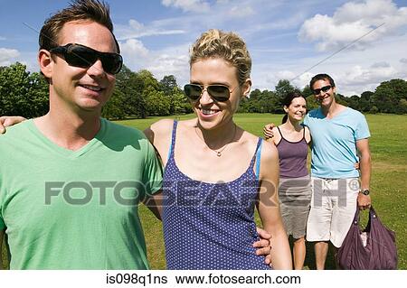 Friends in park View Large Photo Image Stock Photograph - Friends in park. Fotosearch