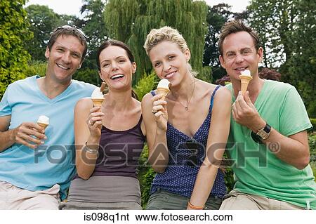 Friends with ice creams View Large Photo Image Stock Photograph - Friends with ice creams. Fotosearch