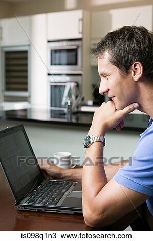 Man using laptop View Large Photo Image Stock Image - Man using laptop. Fotosearch