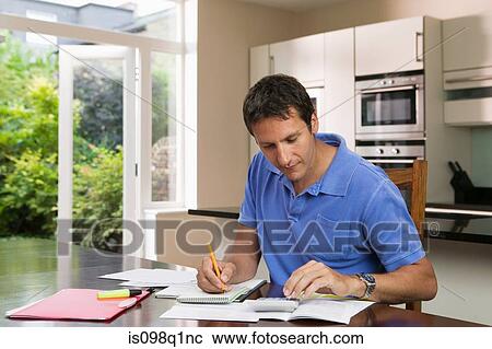 Man with paperwork View Large Photo Image Stock Image - Man with paperwork. Fotosearch