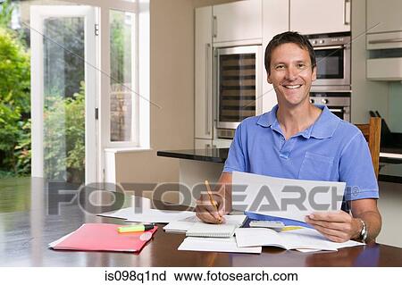 Stock Image - Man with paperwork. Fotosearch