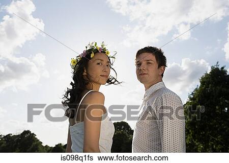 Newlyweds outdoors View Large Photo Image Stock Photograph - Newlyweds outdoors. Fotosearch
