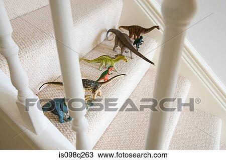 Toy dinosaurs on stairs View Large Photo Image Stock Image - Toy dinosaurs on stairs. Fotosearch