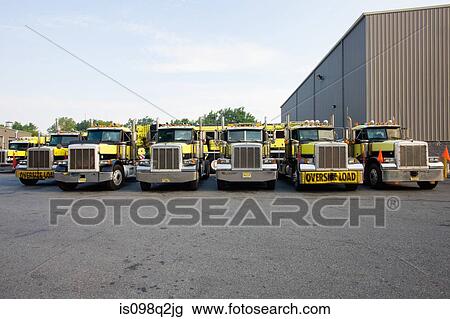 Trucks in a row View Large Photo Image Stock Image - Trucks in a row. Fotosearch