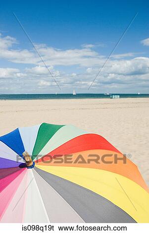 Stock Photograph - Umbrella on beach. Fotosearch