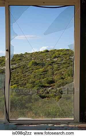 Stock Photo - View through broken window. Fotosearch